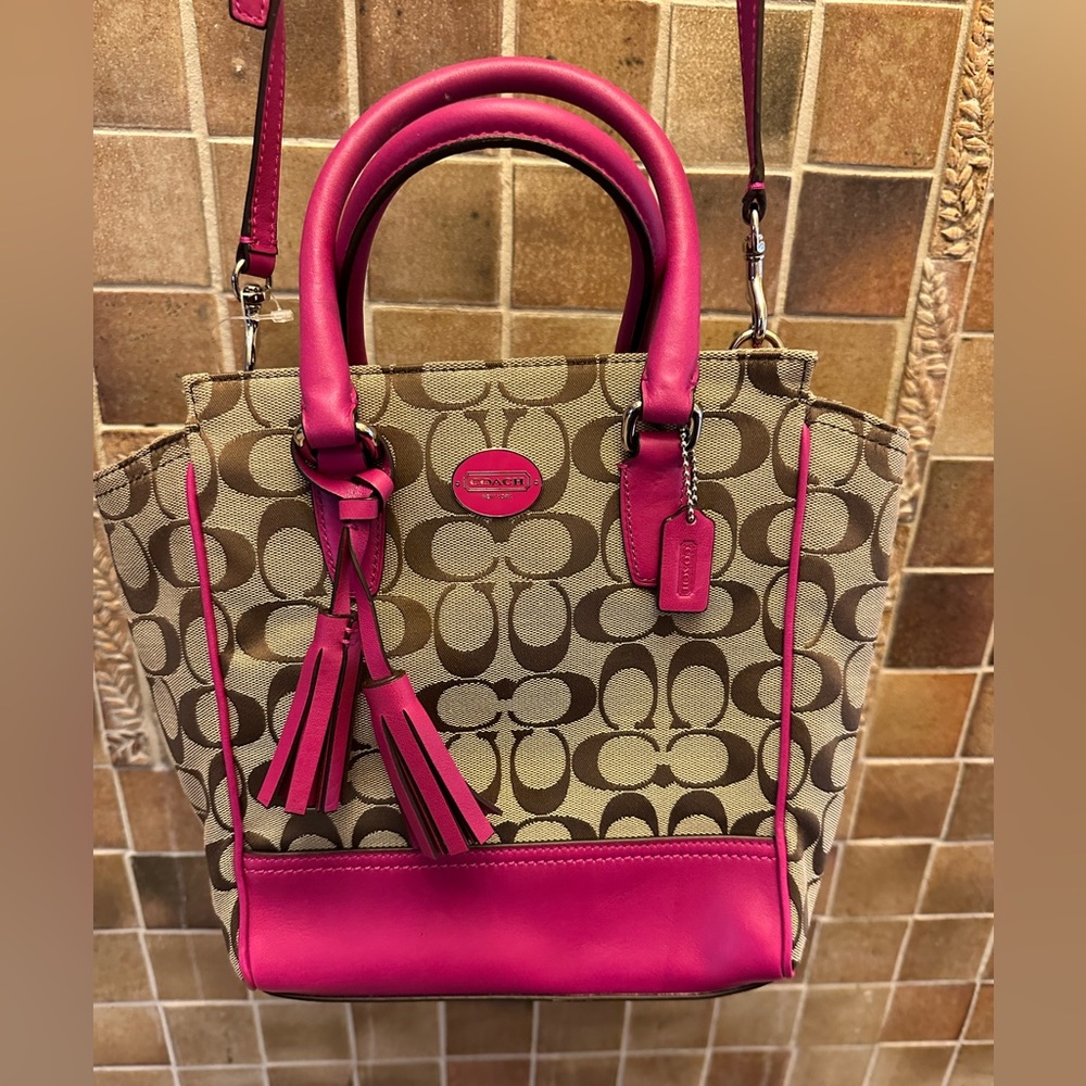 Darling Coach bag 9" H 8" W 3" A In bright pink leather & tan fabric Great cond.
